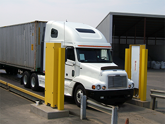 Model 4525-7000 with a white semi-truck driving through